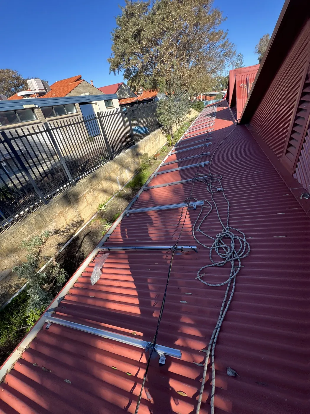 Solar racking along a long school building roof
