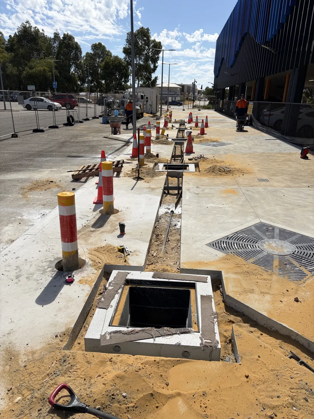 New pit and conduit run along the car park footpath