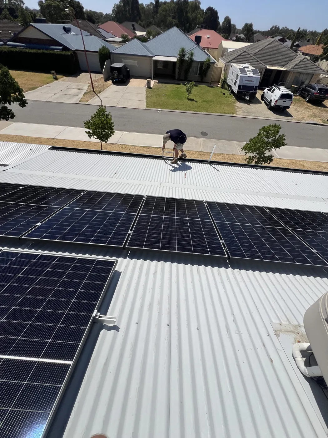 Installer on the roof of a MercyCare home in Seville Grove